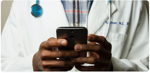 Clinician holding smartphone.