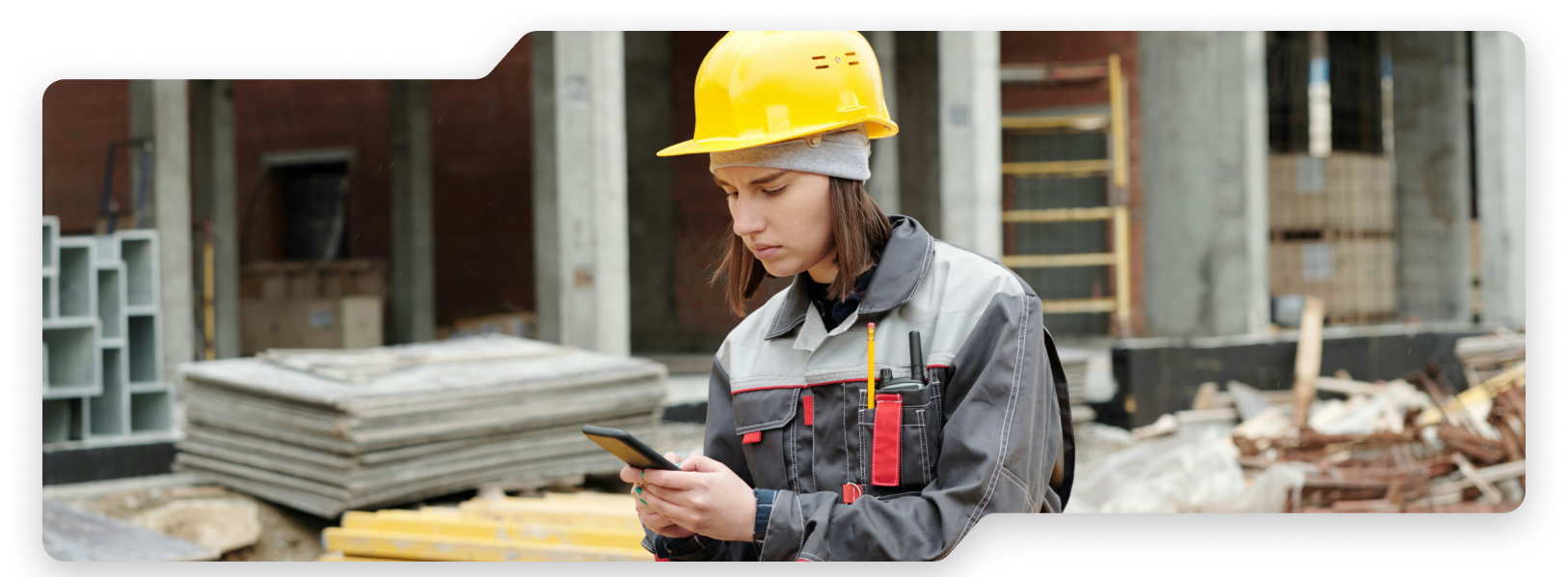 Woman at a construction site using Unite's Single Number Reach service.