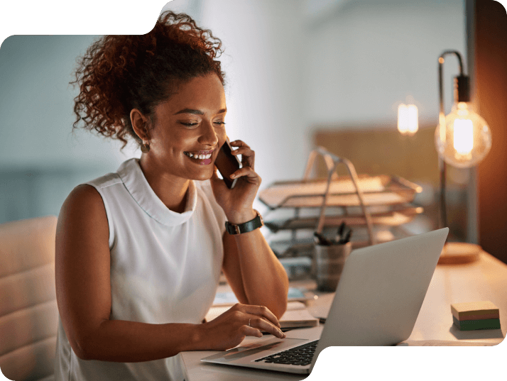 Woman on phone and laptop